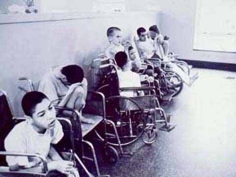 Children lined up in wheelchairs