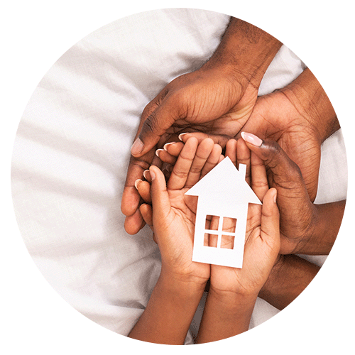 hands holding a paper house
