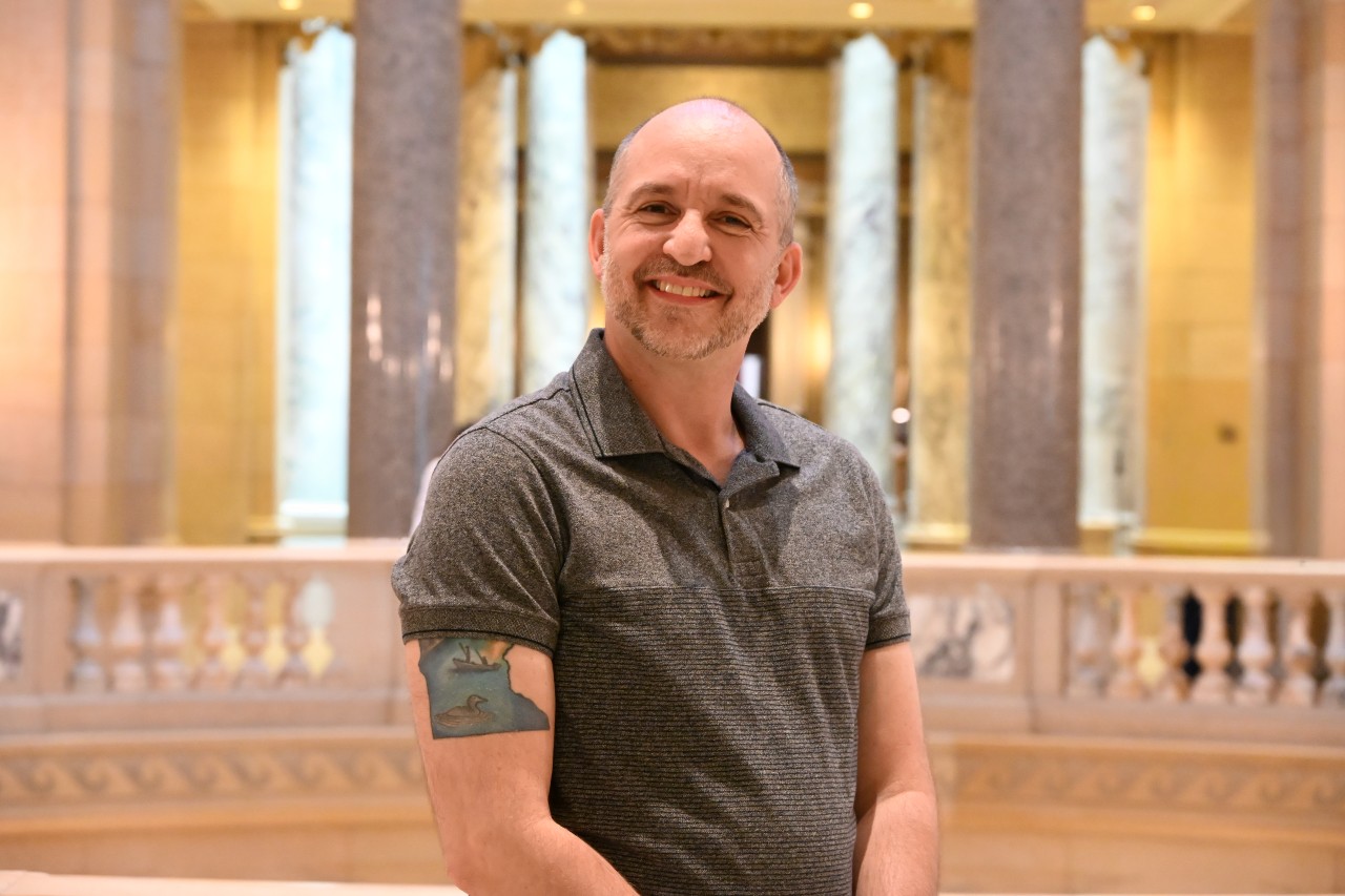 Smiling person within the Minnesota State Capitol