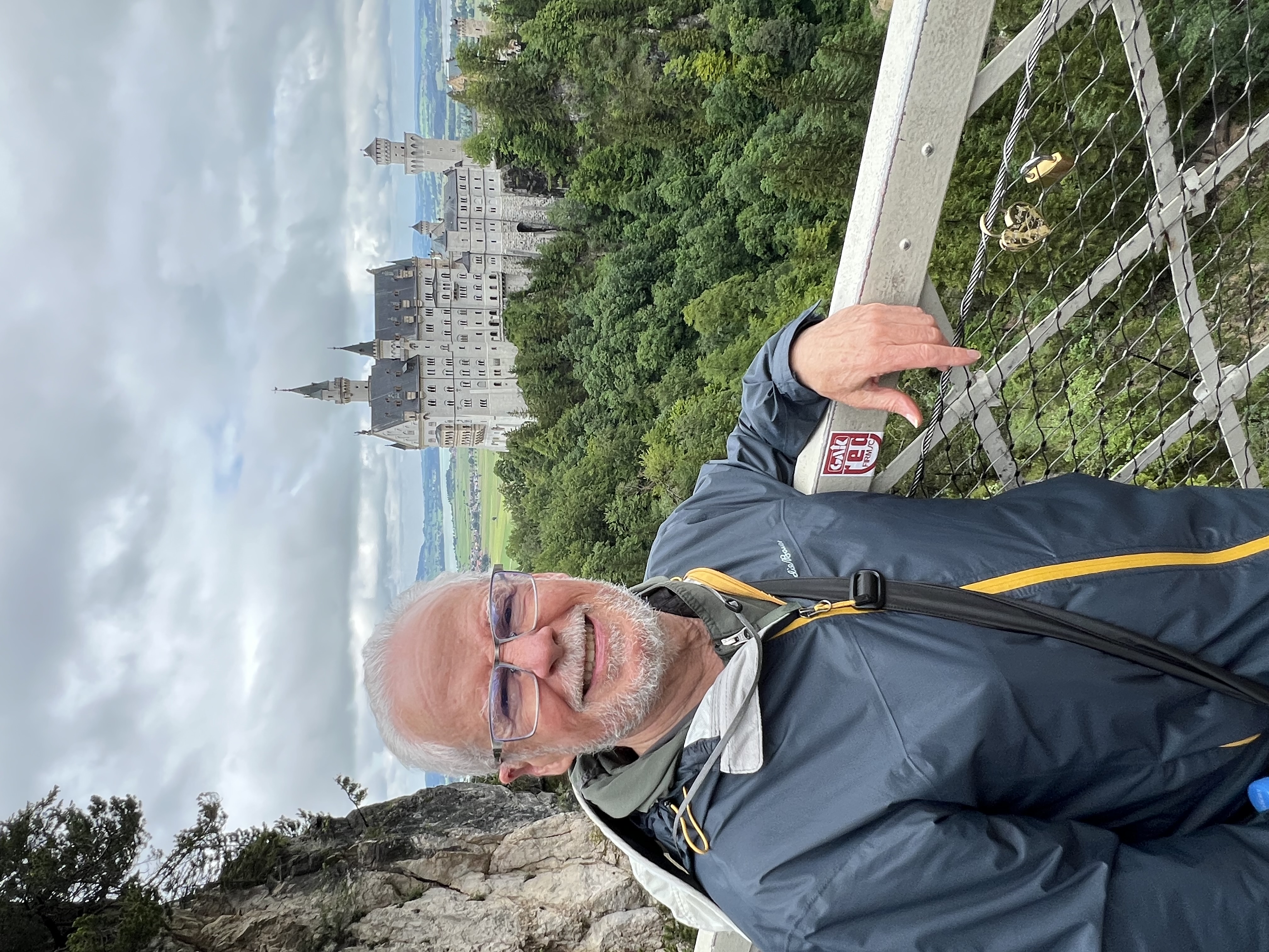 Bob standing on the bridge with a view of Neuschwanstein Castle behind him.