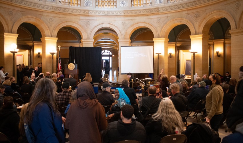 Minnesota State Capitol Rotunda with Lobby Day participants in conversation