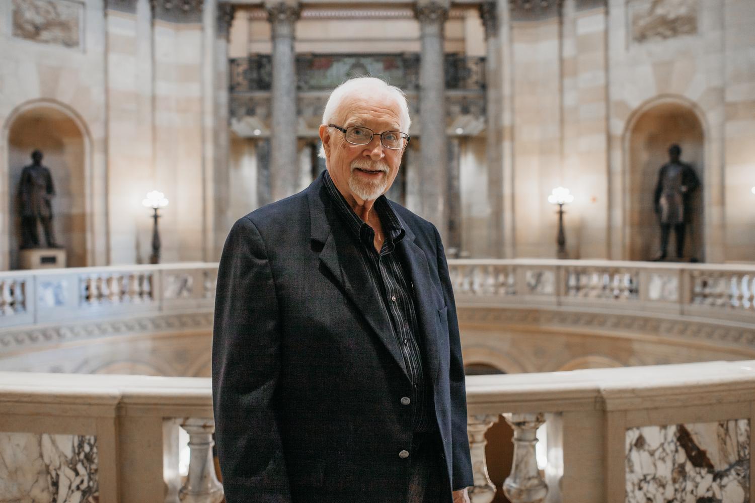 Barry in business attire, inside the Capitol Rotunda