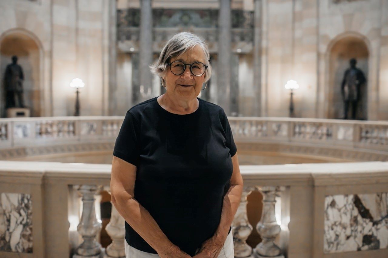 Person standing within the Capitol Building, near the Rotunda