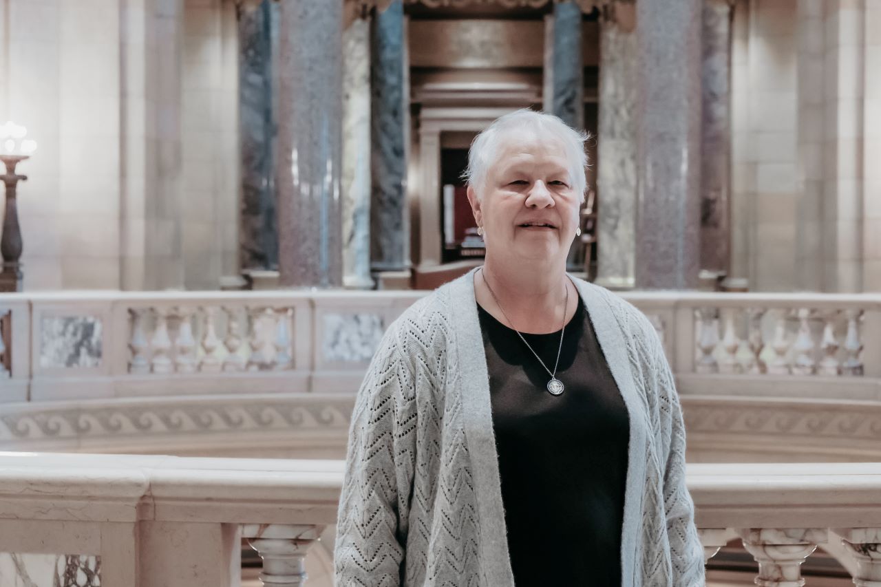 Person standing within the Capitol Building, near the Rotunda