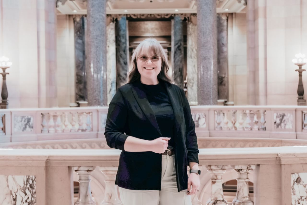 Person standing within the Capitol Building, near the Rotunda