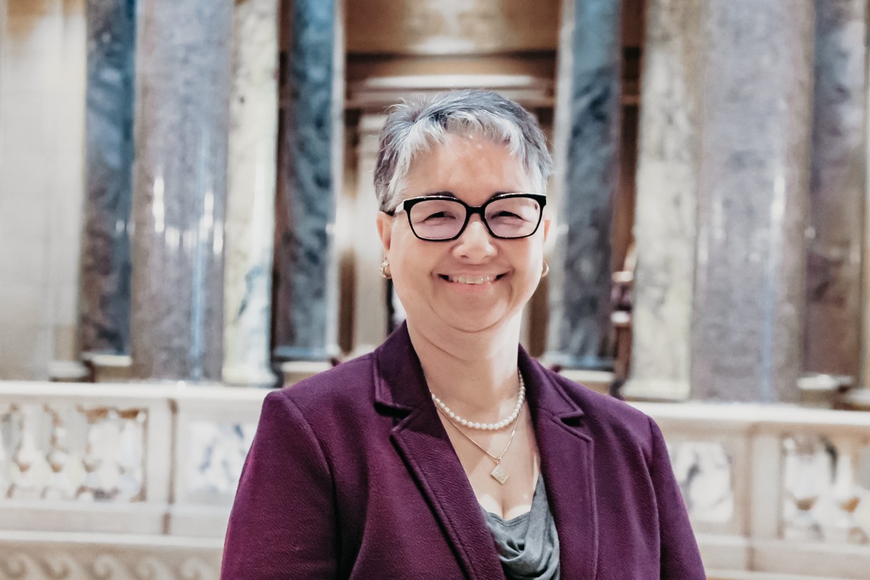 Person standing within the Capitol Building, near the Rotunda