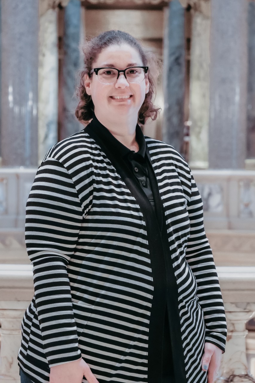 Person standing within the Capitol Building, near the Rotunda
