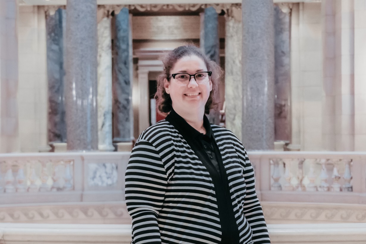 Person standing within the Capitol Building, near the Rotunda