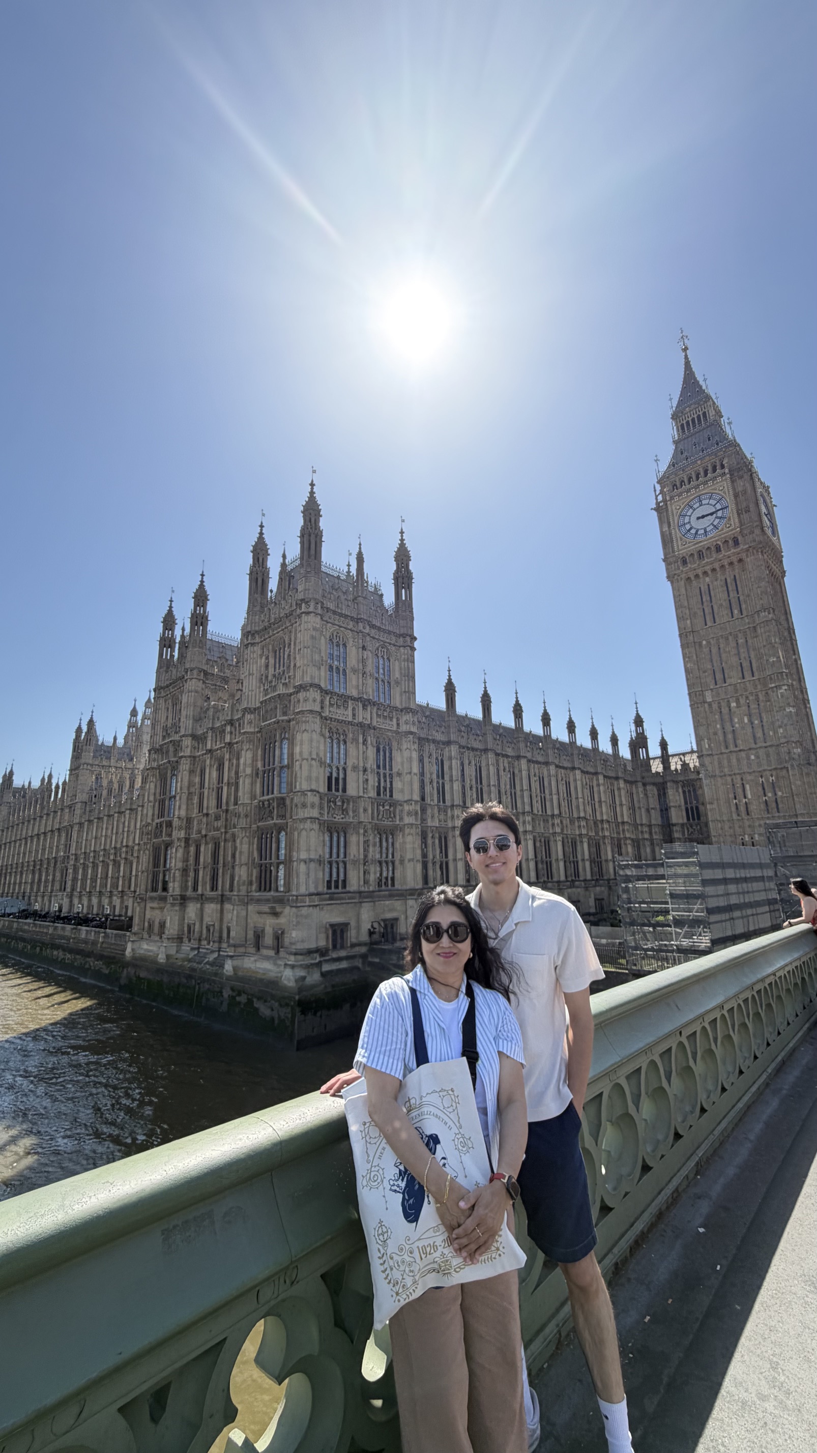 Scenic snapshot of Rania and her son in London with Big Ben visible behind them.