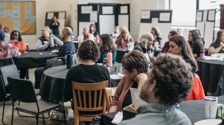 Room full of Interpreting Forward participants at a summit