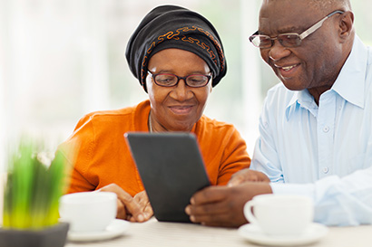 Older couple using a tablet device together.
