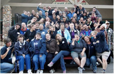 Large group of DeafBlind Minnesotans and their Support Service Providers at Camp Courage