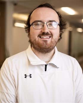 Sam simles for a professional picture 