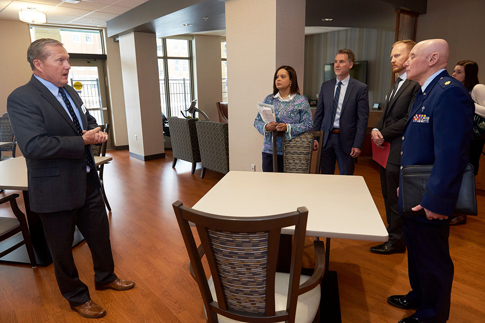 MDVA Deputy Commissioner of Veterans Health Doug Hughes leads speakers on a tour of Building 22