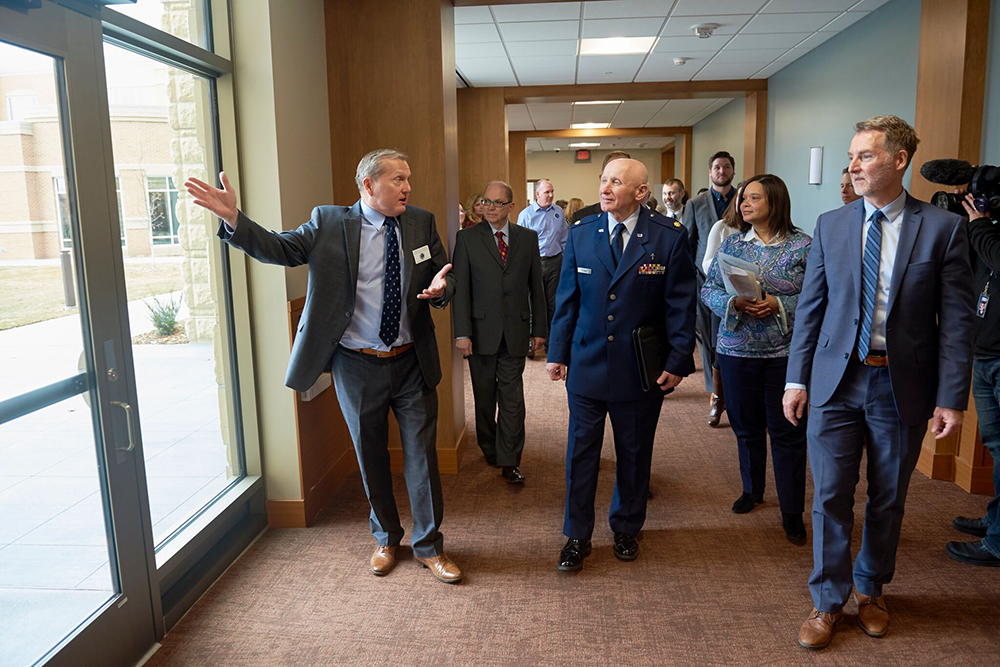 MDVA Deputy Commissioner of Veterans Health Doug Hughes leads speakers on a tour of Building 22