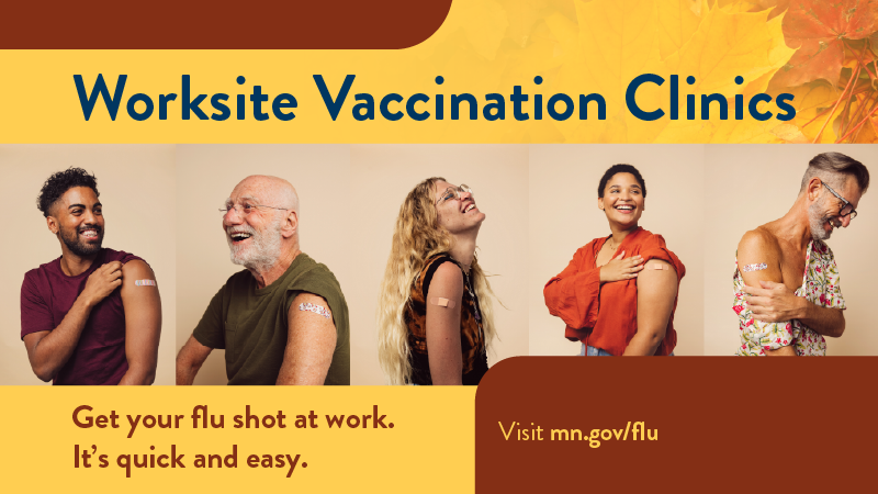 Five state employees smiling while raising the sleeves of their shirts to show their bandaids where they received their flu vaccination shot. 
