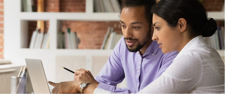 Two people reviewing applicants.