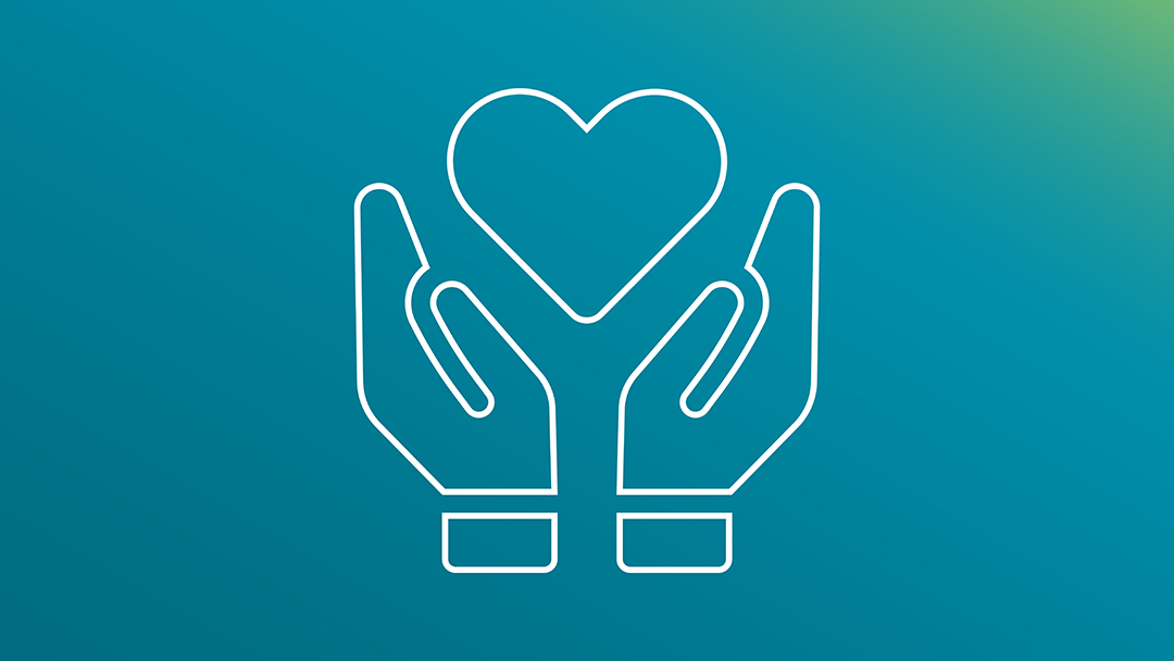 Two hands lifting up a heart