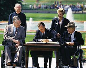 Bush signs ADA of 1990