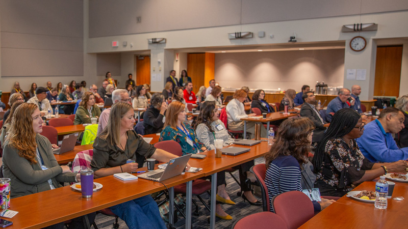 A room of attendees during the SPM Summit
