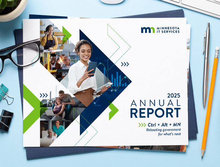 Cover of the 2025 MNIT Annual report sitting on a desk 