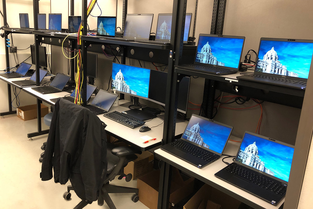 Room full of multiple computers. 