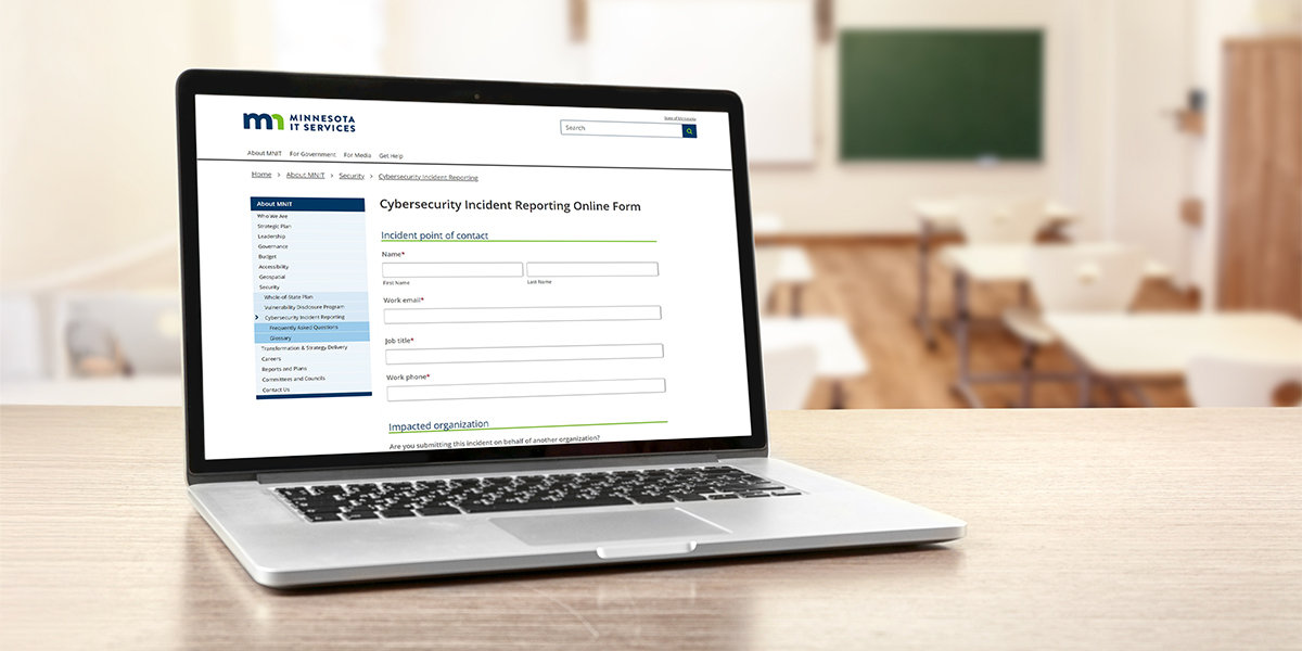 Laptop computer open to the landing page with a form for reporting cybersecurity incidents to the state of Minnesota.