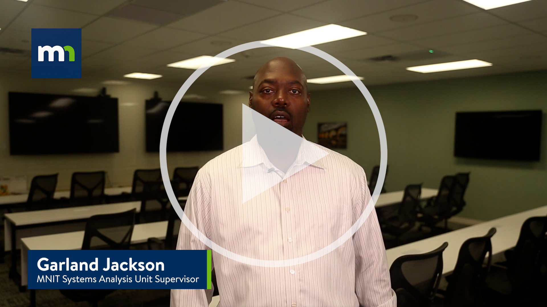 still image of Garland Jackson, MNIT Systems Analysis Unit Supervisor with a play button indicating a thumbnail for a video