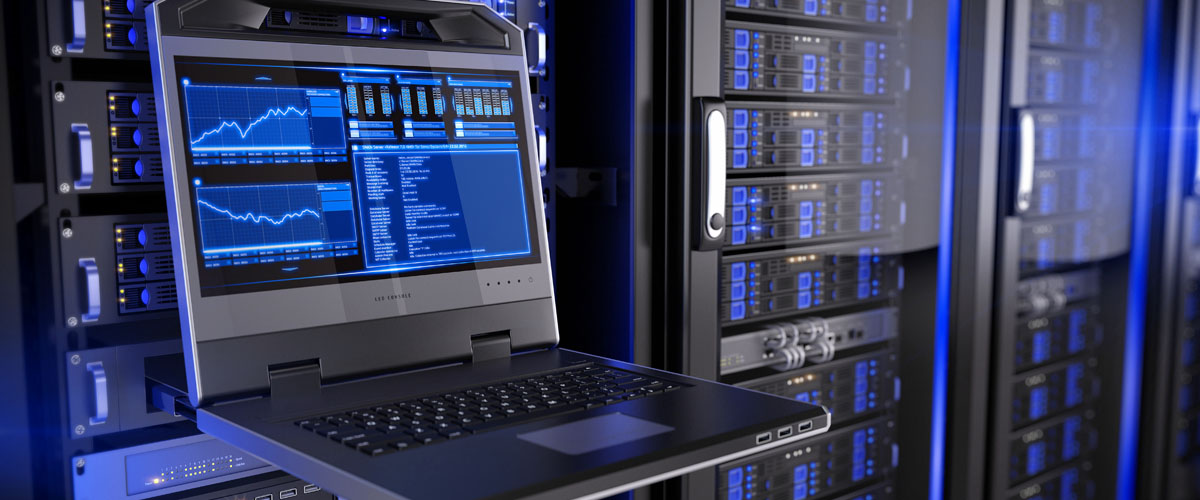 A server room with an open laptop showing statistics.