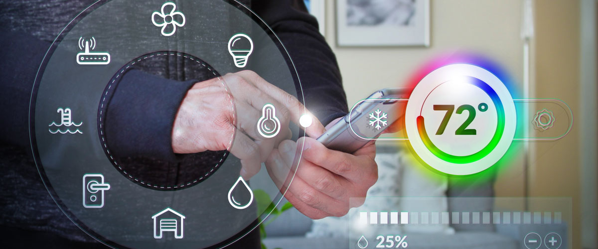 A man adjusting the settings in his home through his cell phone.