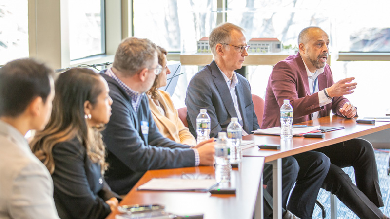 MNIT Commissioner Tarek Tomes and a panel of speakers at the CX Summit.