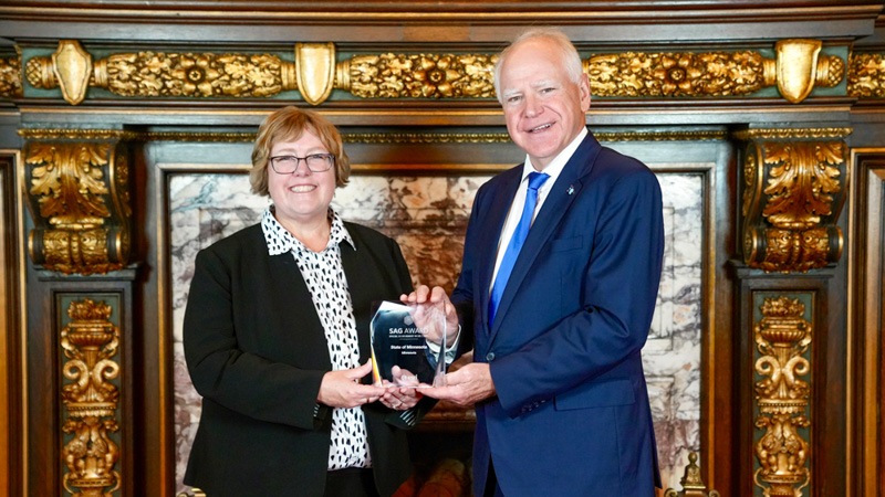 Governor Tim Walz and MnGeo Director Alison Slaats with the 2025 Special Achievement in GIS Award