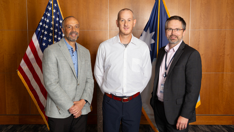 Manager of the Year winner Clif Meier with MNIT Commissioner Tarek Tomes and Deputy Commissioner Jon Eichten