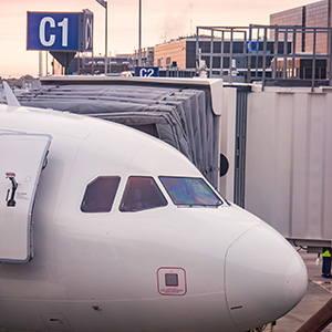 An airplane at an airport gate
