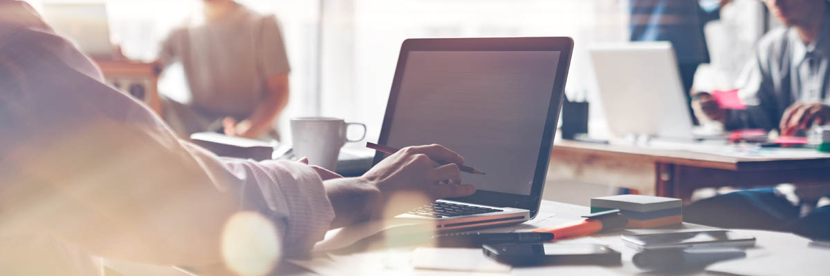 People working with computers and files.