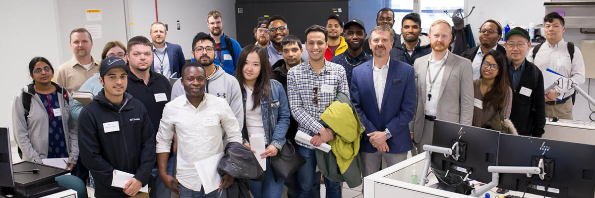 Cybersecurity students posing for a photo with members of the MNIT Security Team.