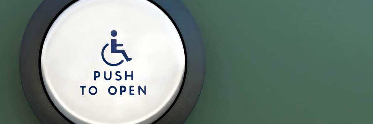 An automatic door switch that shows a wheelchair icon with text - push to open.