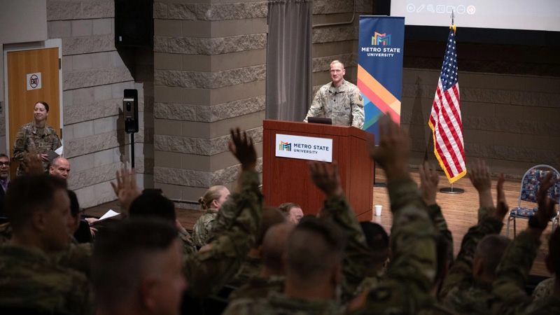 A member of the Minnesota National Guard speakingg at the Military Cyber Symposium.