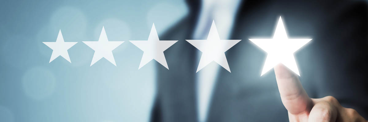 A person selecting 5 out of 5 stars in a rating scale.