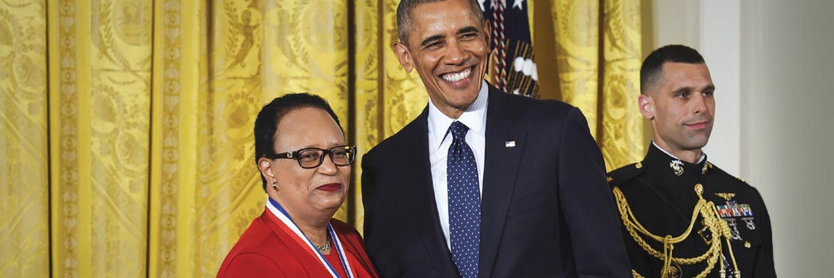 Former President Barack Obama giving Dr. Shirley Jackson the National Medal of Science.
