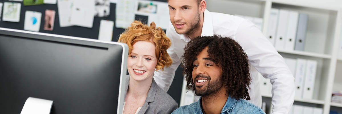 A team working on a computer.