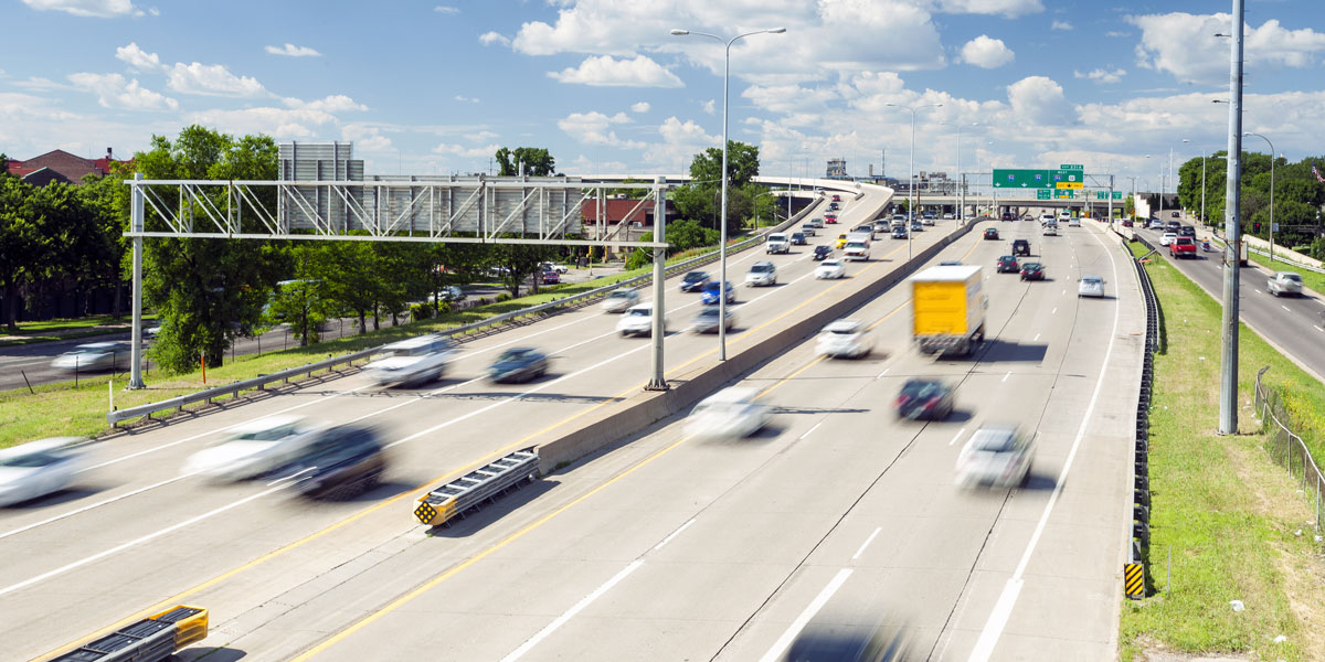 Cars driving on a freeway.