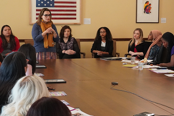 photo of woman presenting before a group