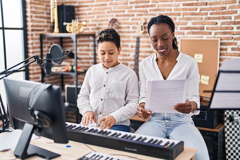 Teacher and Student Playing Keyboard