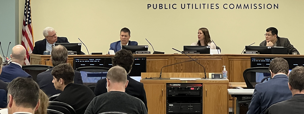 PUC Commissioners at a meeting
