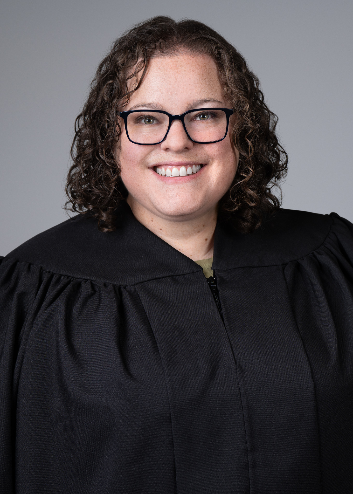 Portrait of Tax Court Judge Beverly Luther Quast smiling in judge's robe