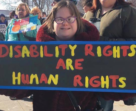 Handmade signs are a staple of Disability Day at the Capitol.