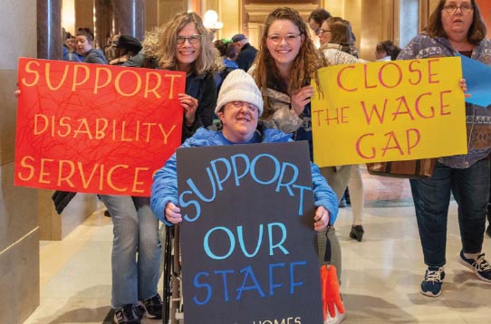 People with disabilities and their allies rally at the capitol this session.
