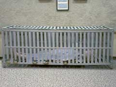 metal crib with mannequin