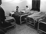 Two men in bed with observer (Dr. Gunnar Dybwad), Cottage 1